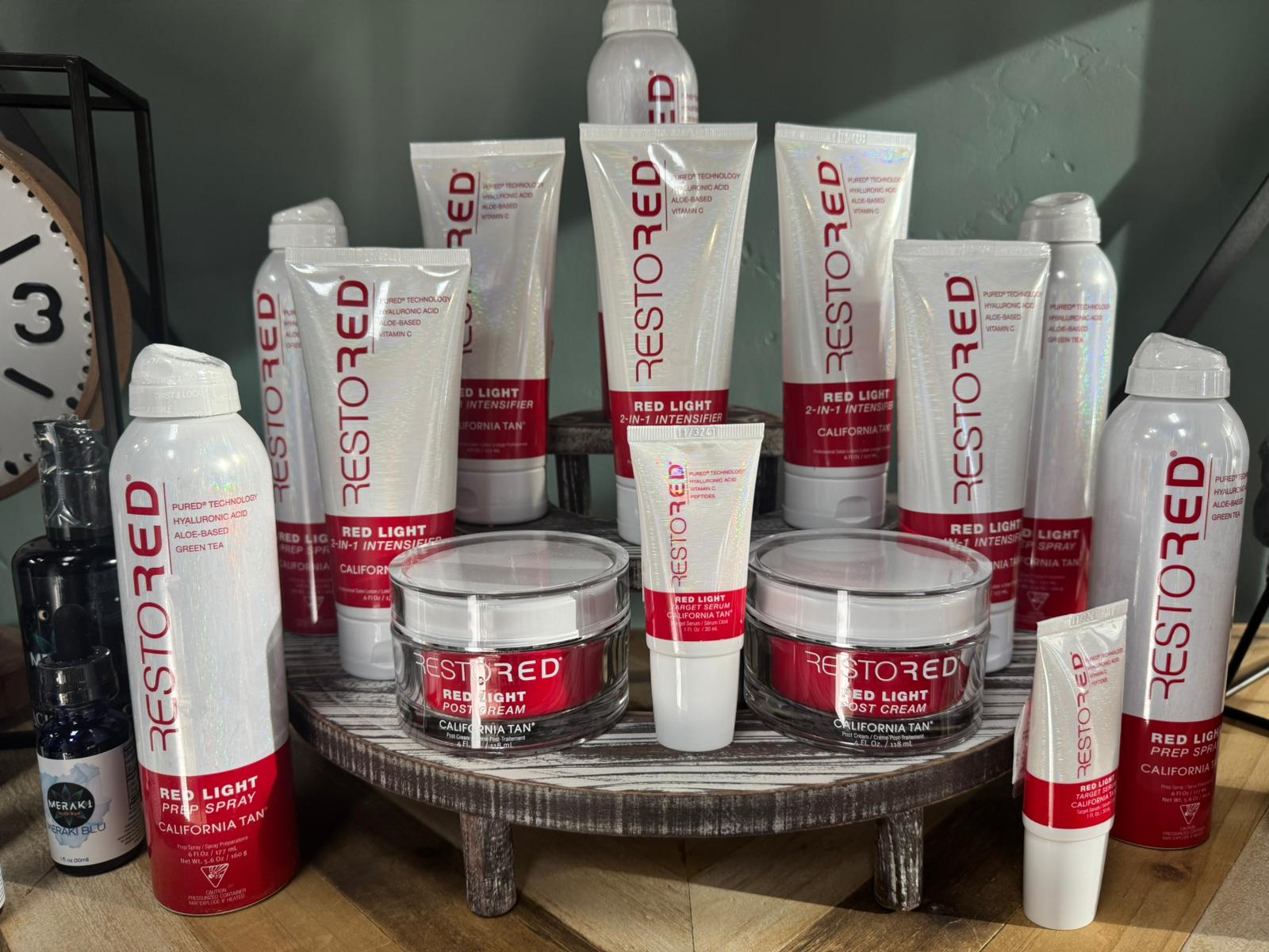 RestoRED red light skincare products on display in the studio.